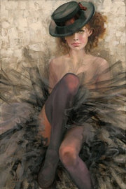 Ballerina wearing a top-black hat, and black tulle outfit.