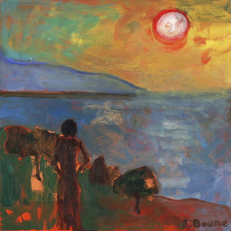 Woman watching the sunset over the bay