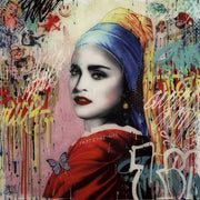 Madonna in red dress, wearing  a blue head scarf 