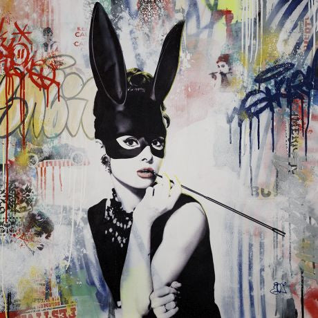 Actress Audrey Hepburn wearing a black bunny mask.