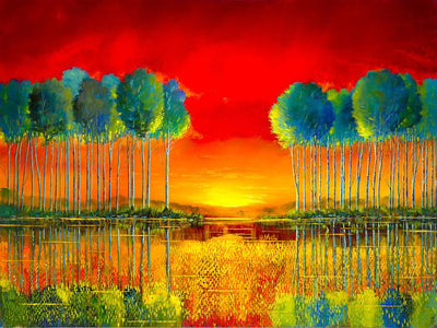 Water reflection of grove of green topped trees at sunset