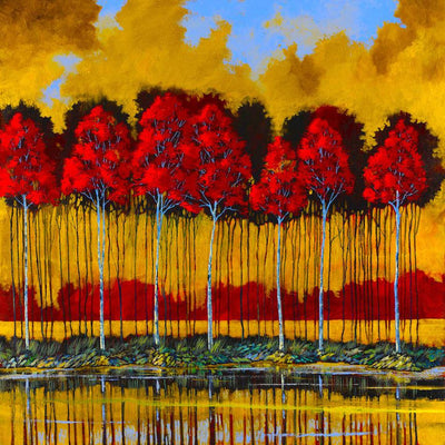 Autumn gold skies hover over the grove of red fall trees