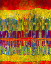 Bold colors in red and gold illuminate the trees reflection in the waterin
