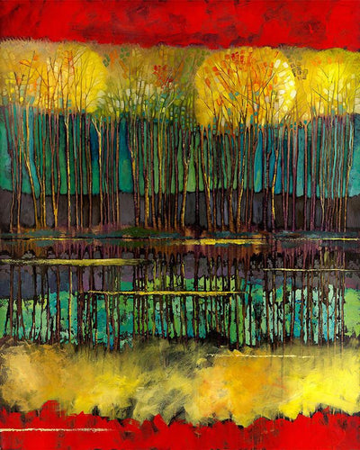 Bold autumn colors reflect the tree line in the waters edge