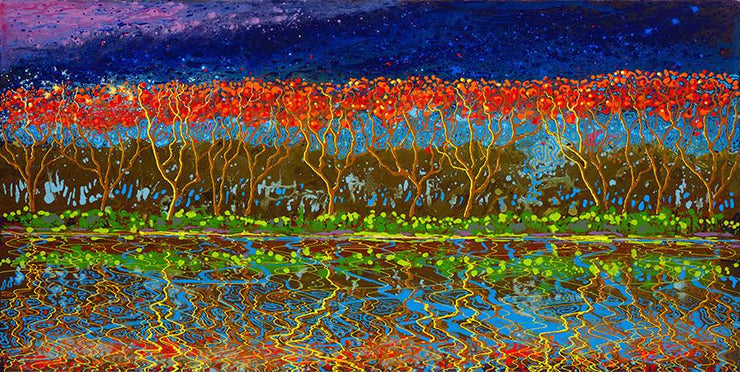 Mirror image on the waterfront of groves of trees in red and blue sky