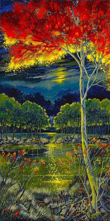 Red-orande tree top shines in the moonlight