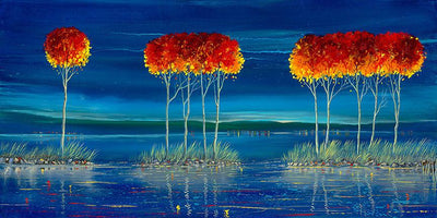 red topped treet on small islands of water over looking the blue sunset