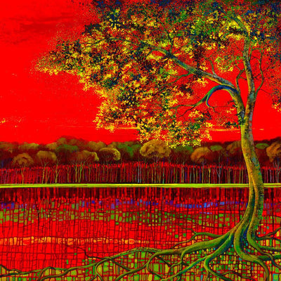 Lone tree by the autumn red sky lake front